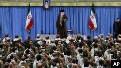 FILE - Iranian Supreme Leader Ayatollah Ali Khamenei gestures during a meeting with commanders of the paramilitary division of the elite Revolutionary Guard in Tehran, Nov. 25, 2015.