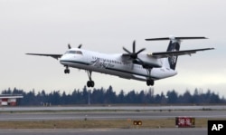 A Bombardier Dash 8 operated by Alaska Airlines Horizon Air takes off on Jan. 26, 2016, at Seattle-Tacoma International Airport in Seattle.