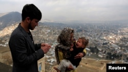 FILE - A child receives polio vaccination drops during an anti-polio campaign in Kabul, Afghanistan.
