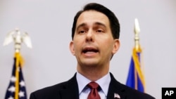 Wisconsin Gov. Scott Walker speaks at a news conference in Madison, Wis., where he announced that he is suspending his Republican presidential campaign, Sept. 21, 2015.