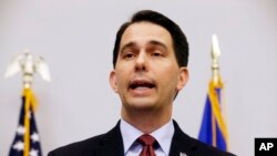 FILE - Wisconsin Gov. Scott Walker speaks at a news conference in Madison, Wis., Sept. 21, 2015. Walker has signed legislation that would cut millions of taxpayer dollars for Planned Parenthood in Wisconsin. 