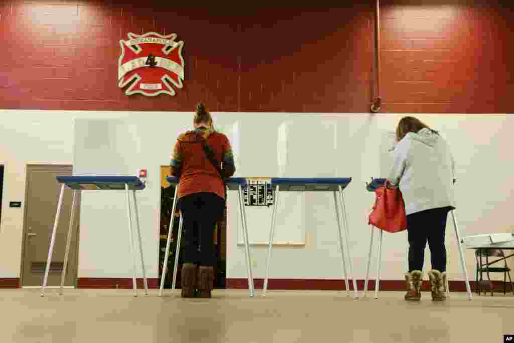 Voters cast their ballot in the Indiana Primary at a fire station in Indianapolis, Tuesday, May 3, 2016.