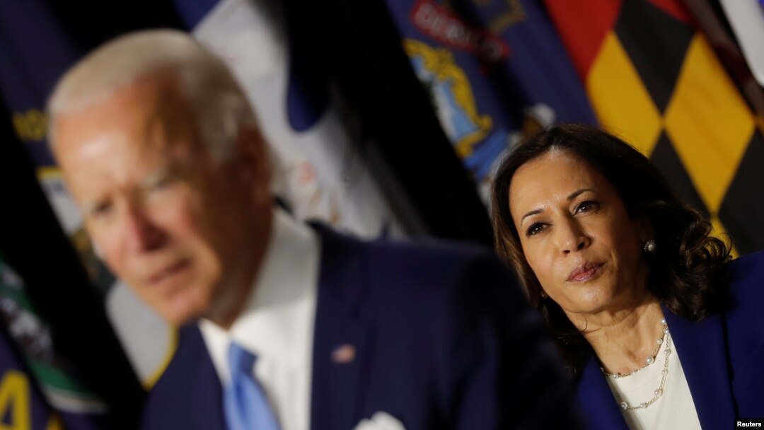 Democratic vice presidential candidate Senator Kamala Harris looks on as Joe Biden speaks