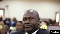 FILE - South Sudan's First Vice President Riek Machar attends his swearing-in ceremony at the State House in Juba, South Sudan, Feb. 22, 2020.