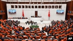 Turkish lawmakers follow the debate of Sweden's bid to join NATO at the Turkish Parliament in Ankara, Turkey, Jan. 23, 2024. The United States welcomed on Jan. 24, 2024, the Turkish legislature's ratification of Sweden's NATO membership bid.