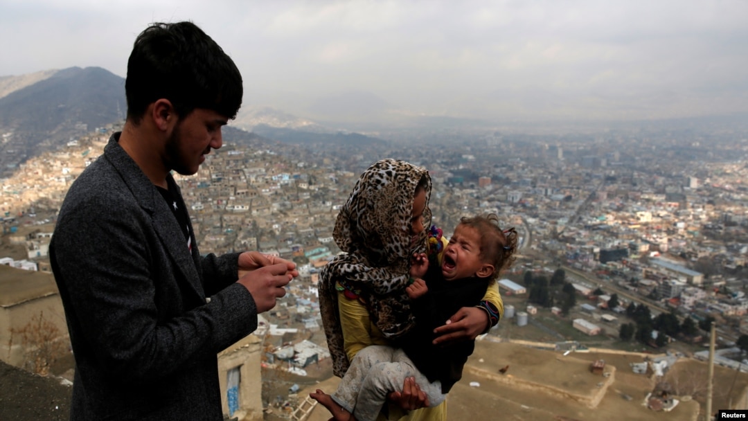 FILE - A child receives polio vaccination drops during an anti-polio campaign in Kabul, Afghanistan.