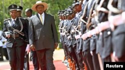 Uganda's President Yoweri Museveni inspects the nation's Honor Guard upon his arrival to deliver his state of the nation address in the capital Kampala, June 4, 2015.