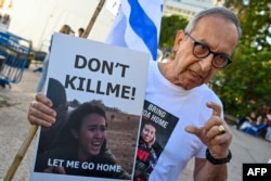 FILE - Yakov Argamani, father of 26-year-old Israeli hostage Noa Argamani, speaks to media outside the Tel Aviv Museum of Art, now informally called the "Hostages Square", in Tel Aviv, Dec. 16, 2023.