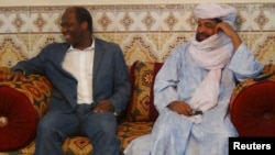 Iyad Ag Ghali, right, leader of Ansar Dine, meets with Burkina Faso foreign minister Djibril Bassole in Kidal, northern Mali, August 7, 2012.