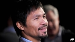 FILE - Manny Pacquiao at a press conference in New York City. Pacquiao has lost a lucrative contract with U.S. sportswear maker Nike, after describing gays and lesbians as "worse than animals."
