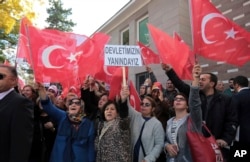 About 150 members of Turkey's ruling Justice and Development Party stage a protest outside the French embassy, accusing France of supporting terrorism, in Ankara, Turkey, Nov. 11, 2016.