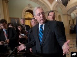 Senate Majority Leader Mitch McConnell, R-Ky., flanked by Sen. Cory Gardner, R-Colo., (L-Rear), and Sen. John Barrasso, R-Wyo. (R-Rear), tells reporters he has not seen a clear indication that Congress needs to step in and pass legislation to prevent the firing of special counsel Robert Mueller, April 10, 2018.