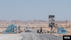 FILE - A checkpoint in the desert of the Somali region of Puntland leads to the port city of Bossaso, March 25, 2018. Authorities in Puntland announced this week measures to disrupt Islamic State financial networks in Somalia.