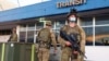 Australian soldiers stand outside the airport in Honiara, Solomon Islands, Nov. 27, 2021. 