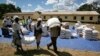 Zimbabwean villagers collect their monthly rations of food aid from Rutaura Primary School in the Rushinga district of Mt Darwin about 254km north of Harare, Zimbabwe, March 7, 2013. 