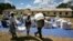 Zimbabwean villagers collect their monthly rations of food aid from Rutaura Primary School in the Rushinga district of Mt Darwin about 254km north of Harare, Zimbabwe, March 7, 2013. 