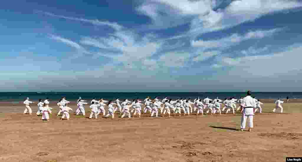 Members of the Seki Ryuzan Karate club demonstrate their skills during the 30th anniversary of the club on the Benllech beach in Benllech, United Kingdom. (Photo by Liza Nagib) 