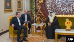 This handout picture from the official Bahrain News Agency shows Bahrain's King Hamad bin Isa Al Khalifa, right, meeting with Iran's Foreign Minister Abbas Araghchi in Manama, Bahrain, Oct. 21, 2024. (AFP Photo/BNA)