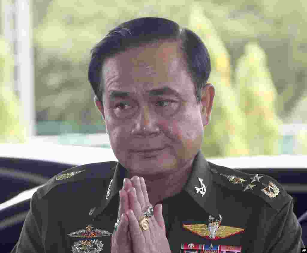 Thai Army Chief Gen. Prayuth Chan-Ocha greets other officers upon his arrival at an army club for a meeting with high ranking officials after declaring martial law, in Bangkok, Thailand, May 20, 2014.