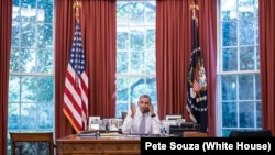 President Barack Obama talks on the phone with Cuba President Raúl Castro in the Oval Office, Sept. 18, 2015. (Official White House Photo by Pete Souza) 