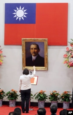 Standing in front of a portrait of the founding father of the Republic of China, R.O.C., Dr. Sun Yat-sen, Taiwan's President Tsai Ing-wen recites the oath of office during the swearing-in ceremony at the Presidential Office in Taipei, Taiwan May 20, 2016.