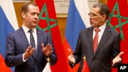Russian Prime Minister Dmitry Medvedev, left exchange greeting with his Moroccan counterpart Saad-Eddine El Othmani after signing agreements during a meeting of the Moroccan and Russian officials in Rabat, Morocco, Oct. 11, 2017. 