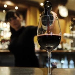 A server pours wine at a restaurant in Los Angeles, California