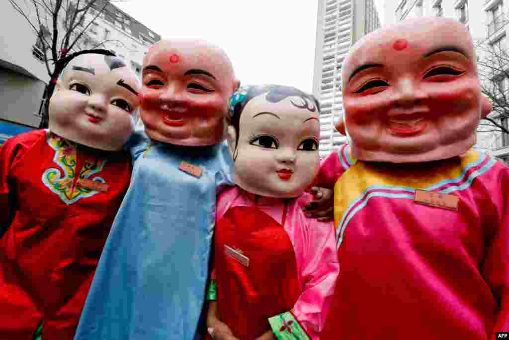 Members of the Chinese community parade to celebrate the Chinese Lunar New Year in the 13rd district of Paris, France.