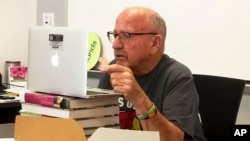 In this photo provided by Farmington Municipal Schools, Gerald Bonds, 86, speaks with an AP reporter via video chat at Farmington High School on Sept. 14, 2020, in Farmington, N.M. (Farmington Municipal Schools via AP)