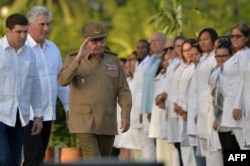 The First Secretary of Cuba's Communist Party Raul Castro (C) and President Miguel Diaz-Canel (2nd-L) arrive at the Santa Ifigenia Cemetery in Santiago de Cuba, Jan. 1, 2019, to celebrate the 60th anniversary of the revolution.