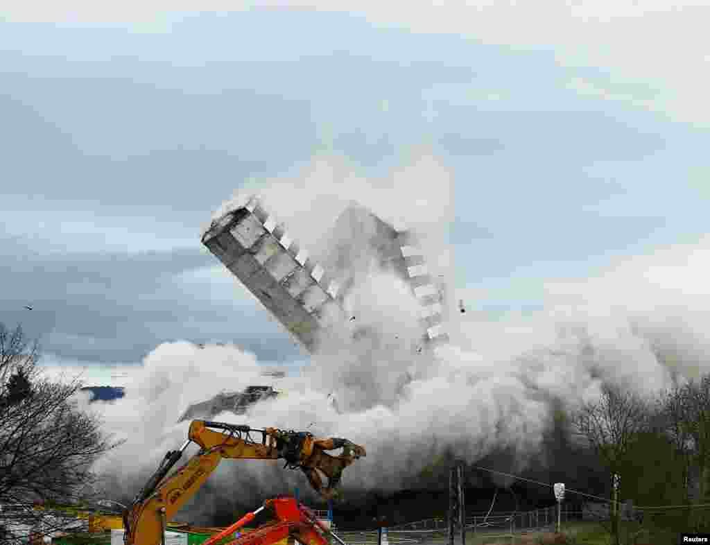 The Bonn Center topples during a controlled demolition in Bonn, Germany.