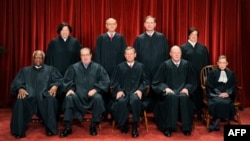 The Justices of the US Supreme Court sit for their official photograph on October 8, 2010 at the Supreme Court in Washington, DC, October 8, 2010.