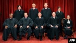 FILE - Justices of the U.S. Supreme Court sit for their official photograph in Washington, Oct. 8, 2010.