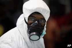 A Nigerian port health official wears protective gear at Murtala Muhammed International Airport in Lagos, Nigeria, Aug. 6, 2014.