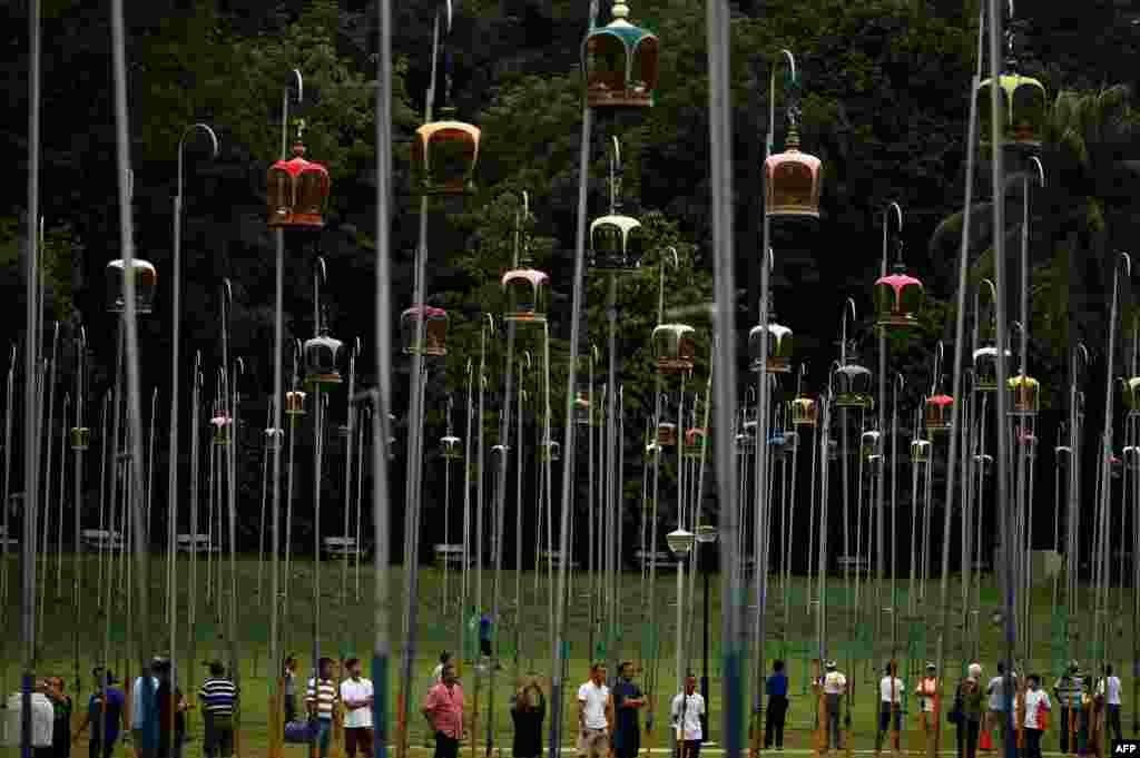 Participants and bird owners wait for the start of the merbok (zebra dove) bird singing competition at the Kebun Baru Birdsinging Club in Singapore, June 23, 2019.