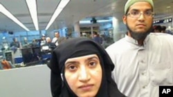 FILE - A July 27, 2014, photo shows San Berdardino attackers Tashfeen Malik (L) and Syed Farook as they pass through O'Hare International Airport in Chicago.