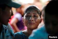 FILE - Claudia Maquin, mother of Jakelin Caal, 7, reacts during her daughter's funeral at her home village of San Antonio Secortez, in Guatemala, Dec. 25, 2018.