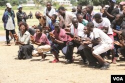 Zimbabwe opposition members march to Zimbabwe Electoral Commission offices despite police declaring the protest confined to a square, March 22, 2017. (S. Mhofu/VOA)