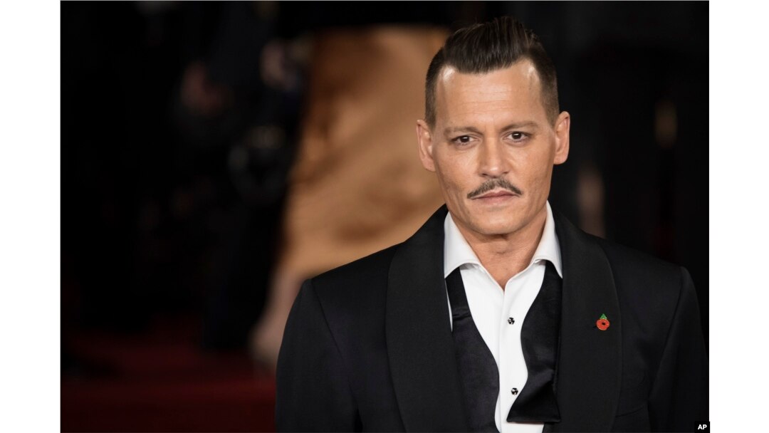 Actor Johnny Depp poses for photographers at the world premiere of the film "Murder on the Orient Express," in London, Nov. 2, 2017.
