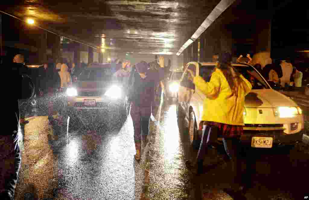 Protesters block traffic as they march in the streets,&nbsp;in St. Louis, Missouri. Ferguson and the St. Louis region are on edge in anticipation of the announcement by a grand jury whether to criminally charge officer Darren Wilson in the shooting death of Michael Brown, Nov. 23, 2014.