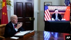 President Joe Biden meets virtually with Chinese President Xi Jinping from the Roosevelt Room of the White House in Washington, Nov. 15, 2021. 