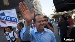 Jerusalem Mayor Nir Barkat waves as he campaigns for mayoral elections in Jerusalem, Oct. 22, 2013. 