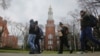 FILE - Brooklyn College students walk between classes on campus in New York, Feb. 1, 2017.