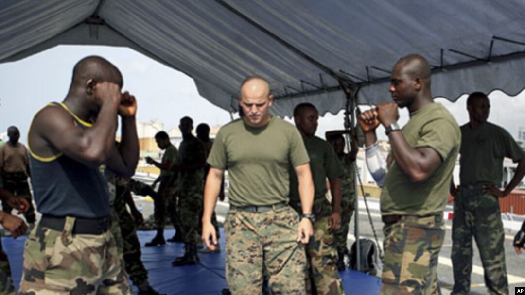 Nigerian navy officers undergo military exercises aboard USS Nashville as US Navy trains partners from around Africa's Gulf of Guinea to help boost maritime security in a region plagued by piracy, drug smuggling and raids on oil facilities, at the Lagos H