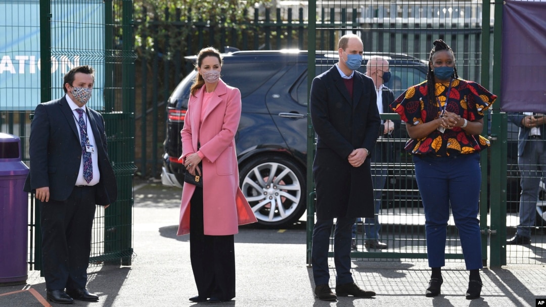 Britain's Prince William with Kate, Duchess of Cambridge visits a secondary school in east London, March 11, 2021 where he defended Britain’s monarchy against accusations of bigotry made by his brother, Prince Harry, and his sister-in-law, Meghan.