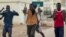 FILE - African migrants react as they arrive at the short-stay immigrant center after crossing the border from Morocco to Spain’s North African enclave of Melilla, Spain, June 26, 2016.