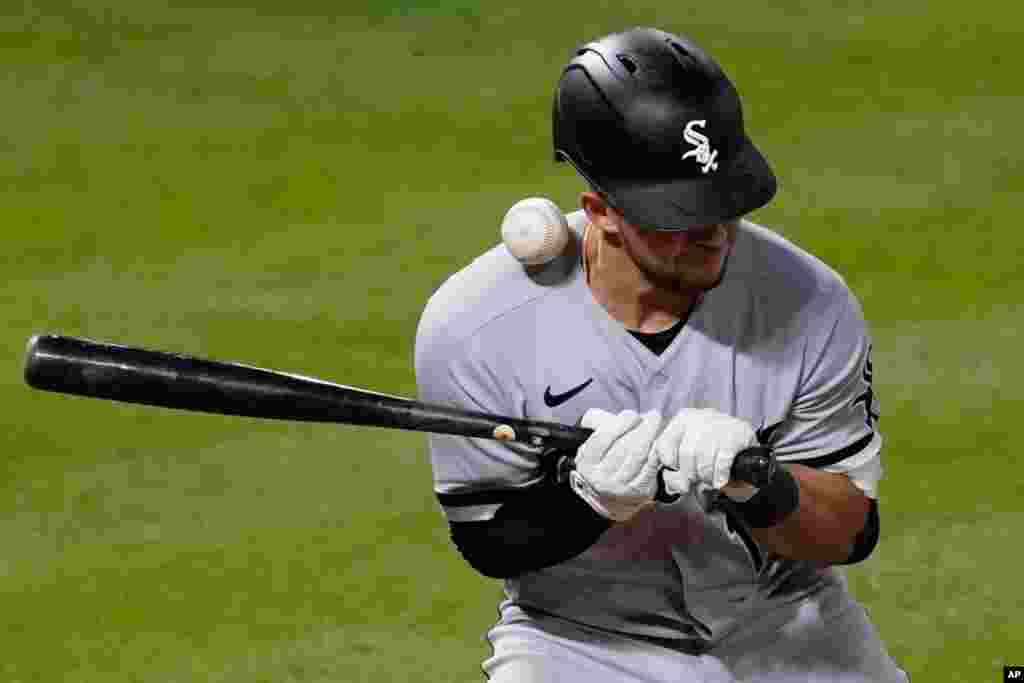 Chicago White Sox&#39;s Nick Madrigal is hit by a pitch from Los Angeles Angels relief pitcher Raisel Iglesias during the ninth inning of a baseball game in Anaheim, California, April 4, 2021.