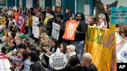 Activists protest in a demonstration at the COP29 U.N. Climate Summit on Nov. 16, 2024, in Baku, Azerbaijan.