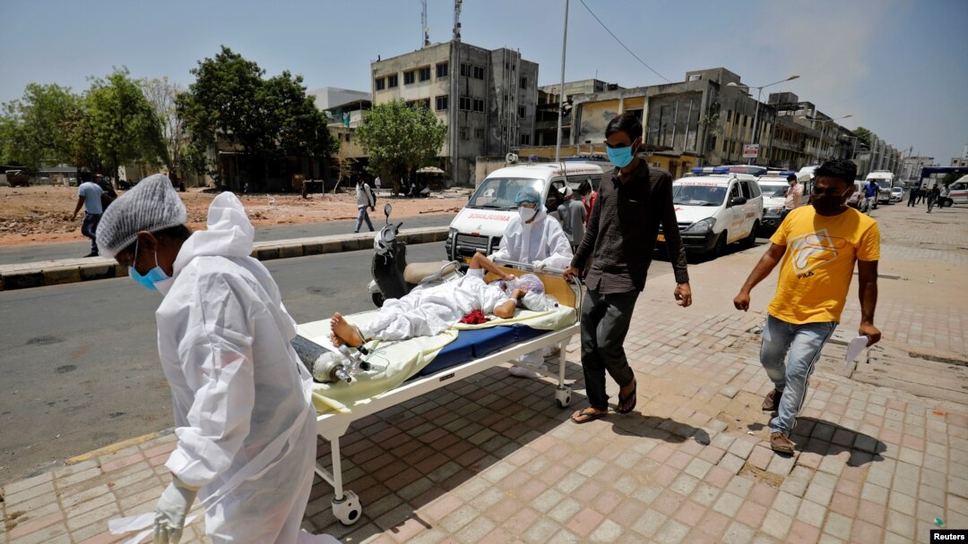 A patient is wheeled outside a COVID-19 hospital, amidst the spread of the coronavirus disease (COVID-19) in Ahmedabad, India, Apr. 19, 2021. 