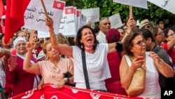 Tunisiennes manifestant pour l’égalité des droits à Tunis, le 13 août 2018. (AP Photo/Hassene Dridi)